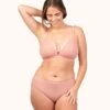 The Ribbed Busty Bralette: Shell Pink -KIKIO Underwear Shop 1 on model front ribbed busty bralette shell pink c3c75129 382c 4552 8bd9 212898e1e269
