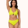 The Ruched Plunge Bralette: Electric Lime -KIKIO Underwear Shop 1 on model front ruched plunge bralette electric lime