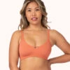The Skinny-Strap Seamless Bralette: Terracotta -KIKIO Underwear Shop 1 on model front skinny strap seamless bralette terracotta