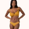 The Unlined Lace Bra: Turmeric -KIKIO Underwear Shop 1 on model front unlined lace bra turmeric